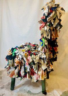 a chair made out of old pieces of paper