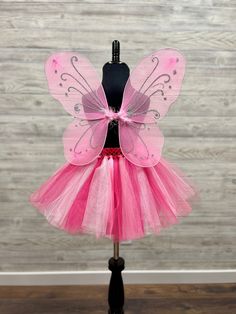 "Fuzzy Duckling Design dresses ~ handcrafted for the little princess in your life. This adorable tutu set includes the tutu skirt, matching ribbon crown and coordinating fairy wings. * The full skirt sparkles and shines with three layers of high quality tulle in matte, shimmer, and glitter finishes. * Tulle is hand-tied onto a wide crocheted band, with an elastic band woven through the material for ease in taking it on and off. * A wide satin ribbon bow is tied to the front of the skirt for an e Playful Fitted Set For Dress-up, Playful Fitted Dress-up Sets, Fitted Pink Set For Costume Party, Pink Fitted Sets For Costume Party, Pink Dress-up Sets For Spring, Pink Fitted Set For Costume Party, Cute Pink Party Sets, Cute Fitted Easter Sets, Pink Fitted Princess Sets