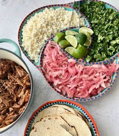 three bowls filled with different types of food