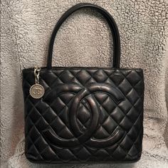 Vintage Chanel Caviar Medallion Tote Approx 12”L X 6"W X 10"H Handle Drop Approx 6.75" Black Quilted Caviar Leather Diamond Pattern Quilting Zip Top Closure With Medallion Zipper Pull Silver-Tone Hardware Interior Has A Wall Zip Pocket As Well As A Wall Slip Pocket Exterior Has A Back Slip Pocket No Authenticity Card/Box/Dust Bag In Excellent Vintage Condition Additional Photos Available Upon Request :) Chanel Cerf Tote, 31 Bag, Chanel 2019, Vintage Chanel Bag, Chanel Tote Bag, Chanel Chain, Vintage Medallion, Chanel Tote, Red Tote