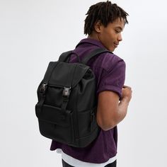 Made for a life in constant motion the League keeps your game plan on track. Crafted of smooth leather this roomy backpack is a comfortable choice for every day with its padded back and straps. Organized with multiple pockets inside and out the sporty style has a dedicated laptop sleeve and plenty of space for notebooks water bottles and other essentials. An exterior zipper gives easy access to the main compartment. | Coach League Flap Backpack - Black Sporty Standard Backpack With Multiple Pockets, Sporty Backpack With Multiple Pockets, Sporty Nylon Backpack With Multiple Pockets, Functional Leather Backpack, Sporty Outdoor Backpack With Multiple Pockets, Modern Backpack With Functional Pockets For Outdoor Activities, Leather Outdoor Backpack With Functional Pockets, Modern Backpack With Adjustable Strap For Outdoor Activities, Functional Travel Backpack With Flap