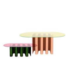 two tables with pink and green bases, one on top of the other in front of a white background