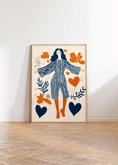 an art print with a woman's figure surrounded by leaves and hearts on a white wall