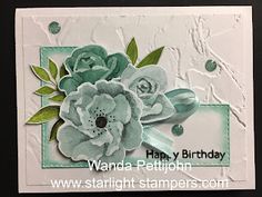 a close up of a card with flowers on it