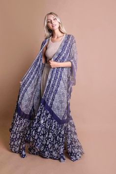 Wear these as a cover up or lower clothing item. Come in flowy paisleys and swirly designs to keep you cool all summer long!Size : 57" x 24"24" Arm Hole Fabric Contents: 100% Viscose Swirly Designs, Paisley, Cover Up, Tapestry, Purple