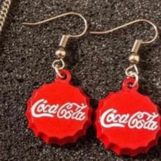 Brand New! Boutique Item! Charming Mini Coca Cola Bottle Cap Round Dangle Earrings! Cute & Small Dangle Earrings Made To Look Like Bottle Caps Of The Soda "Coke". See Pictures For Details. Comfortable & Easy To Wear. I Think We All Know Someone Who Is A Soda Addict - This Is The Perfect Gift For The Coke Brand Snob In Your Life!! Or Give To The Pepsi Lover In Your Family And Watch The Eyes Rollllllll!! Great Gag Gift! -Brand New, Never Worn -Great Gift / Present - Bundle Items In My Closet. The Fun Red Round Jewelry, Nickel-free Casual Party Earrings, Casual Nickel-free Earrings For Party, Casual Red Earrings For Party, Casual Red Party Earrings, Fun Red Adjustable Earrings, Casual Red Nickel-free Earrings, Casual Red Metal Jewelry, Small Dangle Earrings