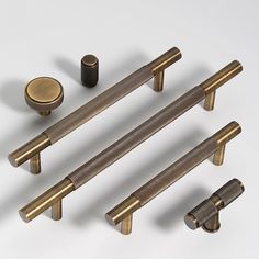 an assortment of brass handles and knobs