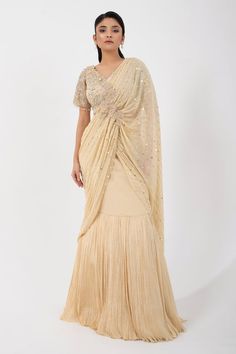 Gold pleated pre-draped skirt saree featuring attached sequin bead embellished pallu with applique and attached can can. Comes with bead embellished floral padded blouse. - Aza Fashions Skirt Saree, Gold Skirt, Padded Blouse, Drape Saree, Draped Skirt, Beaded Neckline, Can Can, Blouse For Women, Sequin Beading