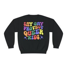 Say Gay Rainbow Unisex Crewneck Sweater  For chilly summer evenings and warm winter layers, sweatshirts are a staple item all year round. The NuBlend® fleece is pre-shrunk, pull-resistant, and quarter-turned so it won't crease in the middle. Made from 50% polyester and 50% sustainably sourced USA cotton, they're very soft to the touch. .: 50% cotton, 50% polyester NuBlend® pre-shrunk fleece .: Medium-heavy fabric (8.0 oz/yd² (271 g/m .: Regular fit .: Tear-away label Multicolor Long Sleeve T-shirt For Winter, Unisex Graphic Print Sweatshirt For Winter, Unisex Winter Sweatshirt With Graphic Print, Multicolor Fleece Crew Neck Top, Unisex Long Sleeve Winter Tops, Multicolor Letter Print Sweatshirt For Winter, Unisex Casual Sweatshirt For Winter, Multicolor Letter Print Winter Sweatshirt, Winter Multicolor Sweatshirt With Letter Print