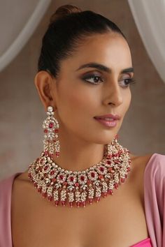 Gold tone necklace with floral cutwork pattern and moissanite polki embellishments with red beaded highlights. Comes along with matching dangler earrings. - Aza Fashions Floral Cutwork, Dangler Earrings, Jewellery Sets, Gold Tone Necklace, Red Bead, Cut Work, Aza Fashion, Necklace Set, Embellishments