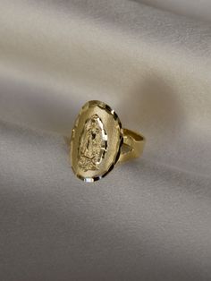 DESCRIPTIONA statement ring if we ever saw one. This ring features the virgin Mary looking rather stunning on a wide band. Guaranteed to have people staring at your... hands. This piece requires custom sizing, making it final sale. DETAILS- always made in 14k gold Virgencita Gold Ring, Unique Gold Halo Rings, Wide Band Ring With Diamond Cut For Gift, Wide Band Diamond Cut Ring As Gift, Gift Rings With Wide Band And Diamond Cut, Gold Mexican Rings, Mexican Gold Rings, Quince Rings, Mexican Rings