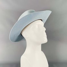 Teressa Foglia Hat In A Light Blue Felt Featuring A Wide Brimmed Fedora Style With Subtle White Stitching Trim Details.Very Good Pre-Owned Condition With Box. Minor Signs Of Wear. Measurements: Opening: 22.5 Inches Brim: 3.5 Inches Height: 4.75 Inches Sui Generis Reference: 133584 Category: Hats More Details Brand: Teressa Foglia Size: 7 3/8 Color: Blue Fabric: Felt. Condition: With Box Age Group: Adult Sui Generis Designer Consignment Is An Award Winning Fashion Resale Store For Women & Men. Lo Fedora Style, Resale Store, Wide Brim Fedora, Felt Fedora, Fedora Hat, Wide Brimmed, Blue Fabric, Gq, Fedora