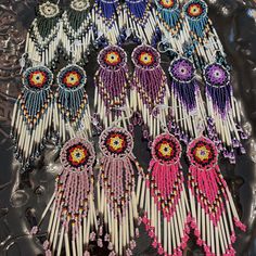 the beads are made to look like fringes or tassels with flowers on them