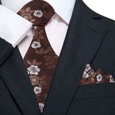 Main Shades of Brown Floral Tie and Matching Square Classic Formal Ties With Floral Print, Elegant Floral Print Accessories For Black Tie, Elegant Floral Print Ties For Gifts, Elegant Floral Print Ties As A Gift, Elegant Floral Print Ties As Gift, Elegant Brown Suit And Tie Accessories For Office, Elegant Brown Suit And Tie Accessories With Pocket Square, Elegant Brown Tie For Semi-formal Events, Elegant Patterned Tie With Floral Print