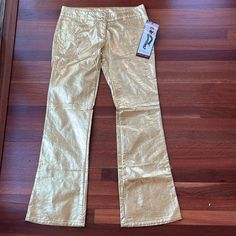 Rare! Nwt Vintage Lip Service Gold Studded Flare Pants 100% Polyurethane Size Large Gold With Silver Buttons One Small Silver Mark On Back Of Leg As Shown Snap And Zipper Closure Casual Fitted Metallic Bottoms, Metallic Fitted Full-length Pants, Metallic Full Length Fitted Pants, Casual Fitted Gold Pants, Gold Fitted Casual Pants, Gold Fitted High-waisted Pants, Spring Fitted Metallic Pants, Fitted Wide Leg Metallic Pants, Fitted Metallic Wide-leg Pants