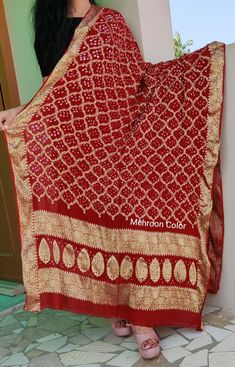 A traditional art work of Bandhej inspired gharchola checks design called as khaddi georgette style on pure georgette fabric. The dupatta is embellished with zari checks and handmade bandhej all over. The dupatta is a good to go item for Indian festives and weddings. In many parts of India it is gifted to the bride as a blessing. We have done the roll press and also the piku(ends binding of the dupatta threads to give it a finished touch) Unstitched Bandhani Print Georgette Dupatta, Navratri Bandhani Print Georgette Dupatta, Festive Bandhani Print Georgette Dupatta, Bollywood Style Georgette Dupatta With Bandhani Print, Bollywood Style Bandhani Print Georgette Dupatta, Traditional Bandhani Print Georgette Dupatta, Unstitched Bandhani Print Dupatta In Chinon, Unstitched Chinon Dupatta With Bandhani Print, Chinon Dupatta With Bandhani Print