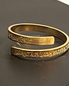 "Elegant and beautiful high quality Accessories:  The ring has \"ayatul-kursi\" \"  Throne Verse\" engraved in Arabic | gold Color | Islamic  Gift | Islamic  ring adjustable  gold Color Alloy ring for women. For your personal use or as a great gift.  Perfect for islamic accessories , featuring Adjustable ring.  Material: High quality alloy metal one size ring that is adjustable" Traditional Adjustable Engraved Ring, Traditional Adjustable Engraved Ring For Anniversary, Traditional Adjustable Engraved Etched Ring, Adjustable Traditional Engraved Etched Ring, Spiritual Adjustable Engraved Wedding Ring, Adjustable Spiritual Engraved Wedding Ring, Adjustable Gold Engraved Ring, Gold Engraved Adjustable Ring, Adjustable Spiritual Engraved Ring For Wedding