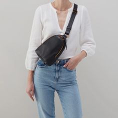 The best way to be is hands-free. Wear Fern Sling as a crossbody or sling it over your shoulder for two looks in one. WHAT IS IT A sling bag. WHY YOU'LL LOVE IT Fern Sling has room for your phone, wallet and keys, and an easy to wear strap for going hands-free. HIGHLIGHTS AND FEATURES 6" W X 8.5" H X 2" D Sandlewood Lining Interior Back: Zip pocket & slip pocket Exterior Back: Signature phone pocket Fits your phone Old English Brass Hardware Zip Closure 13.5" - 21" Strap Drop Solid leather singl Teal Belt, Sage Leaf, Sling Bag Black, Blue Belt, Leather Sling Bag, Crossbody Wallet, Black Exterior, Black Crossbody, Phone Wallet