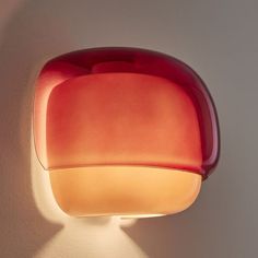 an orange and red light is on the wall