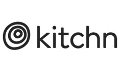 the kitchen logo is black and white with an arrow in it's center,