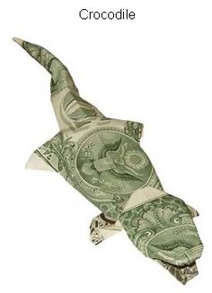 an origami lizard made out of money