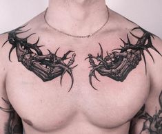 a man with some tattoos on his chest