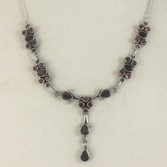 This Beautifully Sweet Sterling Silver Natural Garnet Necklace Has A Mixture Of Round, Oval, And Pear Shaped Garnets. Fun Fact: Garnet Is The Birthstone For January, But Anyone Can Wear It! The Chain Can Be Adjusted To 18 Inches Max (With The Extra Loops) And Has An Extra Garnet At The End Of The Chain For An Extra Bit Of Charm. Let Me Know If You Have Any Questions! Elegant Silver Garnet Necklace, Victorian Necklace, Back To School Clothes, Cool Accessories, Red And Silver, Garnet Necklace, Necklace Red, Beaded Jewellery, Style Upgrade