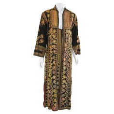 Vintage kuchi dress from Afghanistan, Ethnic Boho Baluchi ethnic dress, embroidered dress circa 1970s. Vintage embroidered Afghan Kuchi kaftan dress coat. Floral patterned cotton with embroidery covering. Stunning intricate Afghan Kuchi tribe embroidery traditional dress. Vintage Beautiful Afghani, Asian, Middle Eastern Bohemian style Maxi Dress kaftan Long sleeves. open front, closes with some breaded buttons. Size medium. Measurements: Bust: 36" Waist: 38". Hips: 40". Across shoulders: 17". Sl Embroidery Traditional, Afghani Dress, Dress Kaftan, Ethnic Dress, Dress Coat, Traditional Dress, Kaftan Dress, Style Maxi Dress, Middle Eastern