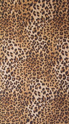 an animal print fabric with brown and black spots