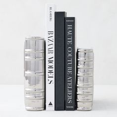 two stacks of books sitting next to each other