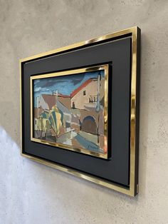 a painting hanging on the side of a wall