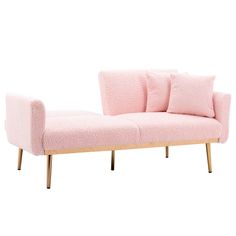 a pink couch sitting on top of a wooden frame