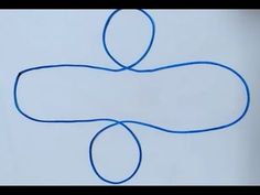 a drawing of an object on paper with blue yarn in the shape of a person's head