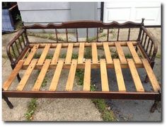 a bed frame made out of wooden slats