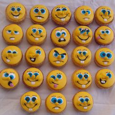 many yellow cupcakes with blue eyes and mouths