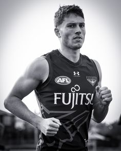 a man running in a black and white photo