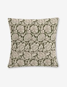 a brown and white pillow with an intricate design