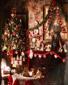 a christmas tree is in the corner of a room with many ornaments and decorations on it