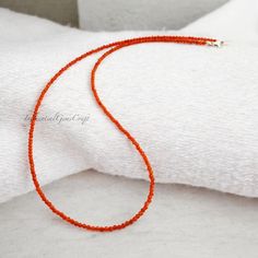 Gemstone: Natural Carnelian   Bead Size: 2mm Approx.   Bead Shape: Round   Cut: Micro Faceted   Length: 18 inches   Material: Carnelian, Sterling Silver   Closure: Sterling Silver Clasp   Style: Delicate, Minimalist   Handmade: Yes   Occasion: Everyday, Boho, Gift Faceted Orange Beaded Necklace As Gift, Minimalist Red Beaded Necklaces, Minimalist Red Beaded Necklace, Gift Carnelian Faceted Beads, Carnelian Round Beads Necklace As Gift, Faceted Minimalist Beaded Necklace For Gift, Minimalist Faceted Beaded Necklace For Gift, Minimalist Faceted Round Beads, Minimalist Faceted Round Beaded Necklaces