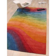 a multicolored area rug on the floor