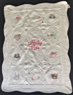 a white quilted blanket with the words happy new on it