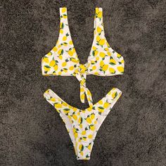 Never Worn. Super Cute But Did Not Fit Me. Two Piece Lemon-Print Bikini. Self-Tie Top With Removable Inserts. High Waisted Bottoms. Fits Like A Size 4. Willing To Sell Pieces Separately! Yellow Lemon Print Swimwear For Beach Season, Yellow Lemon Print Swimwear For Beach, Yellow Lemon Print Swimwear For Pool, Patterned Swimsuit, High Waisted Bottoms, Swimsuit Pattern, Lemon Print, Yellow Print, Fruit Pattern