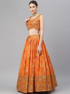 Orange and gold-toned embellished lehenga choli with dupatta, sequinned
Orange and gold-toned embellished unstitched blouse, has a round neck, sleeveless, zip closure
Orange and gold-toned printed semi-stitched lehenga, has drawstring closure, flared hem
Orange and gold-toned printed dupatta, solid border
Size & Fit
Choli at Bust: Customizable upto 42
Lehenga waist: Customizable upto 38
Lehenga Length: 41 inches
Lehenga Flare: 4.00meter
Dupatta Length: 2.55 meter
Dupatta Width: 1.05 meter
Ma Fitted Gold Lehenga With Chandbali Shape, Gold Fitted Chandbali Lehenga, Gold Fitted Chanderi Choli, Festive Gold Choli With Unstitched Blouse, Festive Fitted Kundan Choli, Bollywood Style Art Silk Choli For Eid, Bollywood Art Silk Choli For Eid, Gold Lehenga With Resham Embroidery For Transitional Season, Gold Choli With Gota Work For Transitional Season