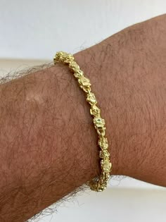 Gorgeous mens handmade nugget link bracelet
5.5mm thick...perfect thickness not too thick yet not too thin so noticeable
Handmade in Italy..no two are alike
 
Solid 925 sterling silver finished in 14k yellow gold
Gold is bonded to solid silver underneath so color wont fade or tarnish for years
Stamped 925
Dont wear the same rope or cuban link as everyone else...get something uinque!

Weighs 20-23 grams depending on length
Very good weight to it!

Very shiny and nicely made!&nbsp Streetwear Jewelry Men, Men’s Gold Jewelry, Streetwear Jewelry, Mens Gold Jewelry, Jewelry Men, Gold Nugget, Jewelry Brand, Cuban Link, Mens Jewelry Bracelet