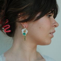 Clock the trend of floral jewelry with these eye-catching, light cream resin flower beads. These exquisite flower-shaped beads have been crafted to thread over our Halo Hoop earrings, adding a touch of femininity to your look. Let the subtle beauty of these beads bring your jewelry to life.*Halo Hoops sold separately. Model is WearingCream Resin Flower Beads on size Medium Gold Halo HoopsIridescent Crystal Studs Dainty White Earrings With Star Charm, White Flower Charm Earrings For Everyday, Trendy White Earrings With Flower Charm, White Flower Hoop Earrings With Flower Charm, Everyday White Flower Charm Earrings, Subtle Beauty, Bead Bar, Elegant Color, Floral Jewelry