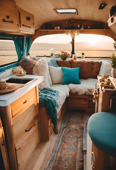 the inside of a camper with lots of furniture