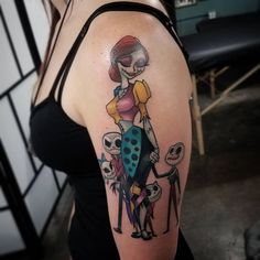 a woman with a cartoon tattoo on her arm