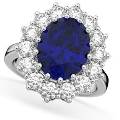 Style Number - AZ16273
This prestigous diamond accented blue sapphire ring is inspired by the engagement ring worn by Princess Diana and Princess Kate Middleton. This unique and luxurious ring makes a statement with its 12x10mm genuine and natural oval shaped blue sapphire that is complemented by 14 brilliant-cut round near-colorless diamonds of G-H Color, SI Clarity in an oval halo fashion. The blue colored gemstone and clear diamond stones rest on a remarkably stunning platinum band.This Lady Blue Sapphire Engagement Ring Oval, Engagement Ring Oval Halo, Sapphire Engagement Ring Oval, Tension Set Engagement Rings, Blue Sapphire Earrings, Cz Rings, Blue Sapphire Engagement Ring, Engagement Ring Oval, Princess Kate Middleton