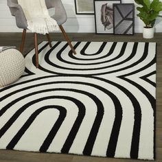 a black and white area rug in a living room