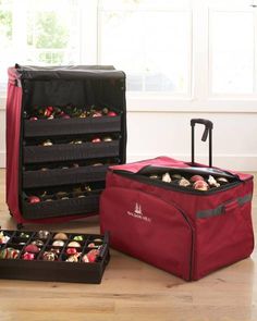 two pieces of luggage sitting on top of a hard wood floor next to each other